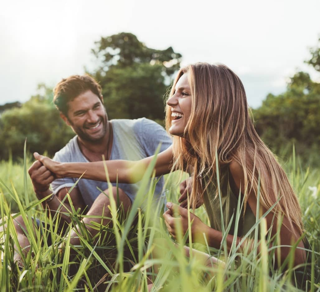 Couple enjoying life with healthy confident smiles after cosmetic dentistry treatment