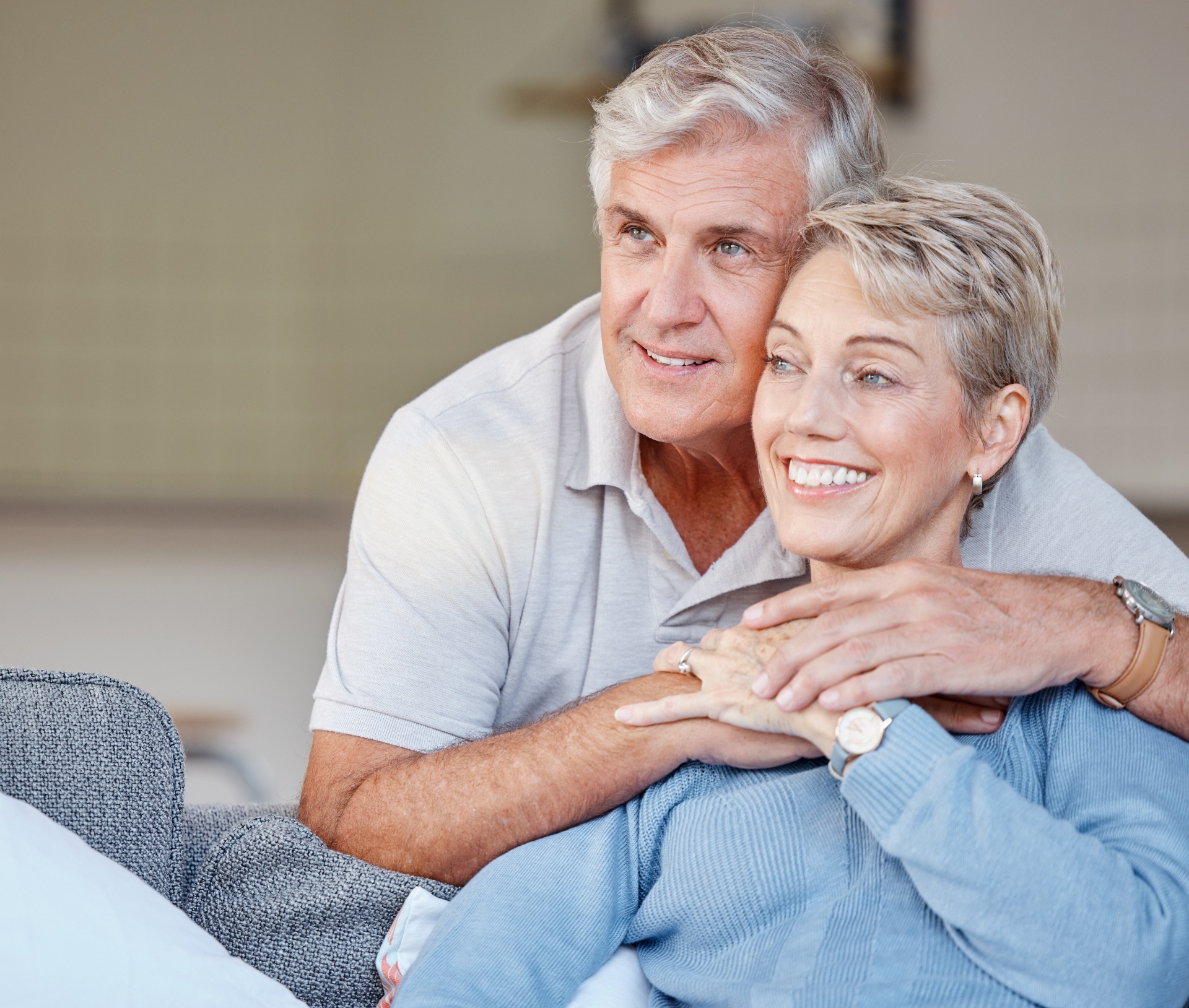 Happy senior couple enjoying life with healthy confident smiles after dental treatment