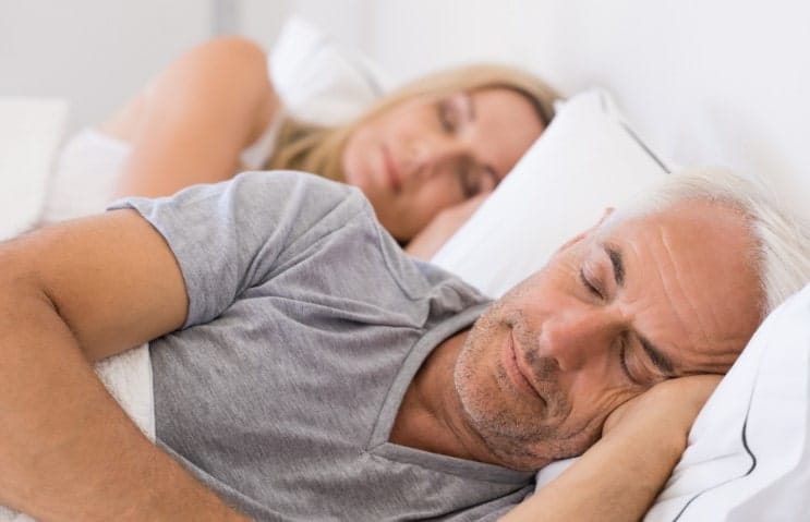 Patient sleeping comfortably after treatment for obstructive sleep apnea